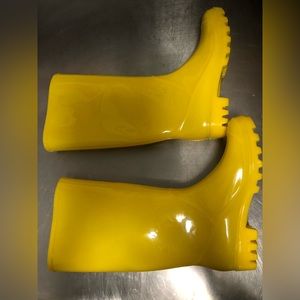 Tall bright yellow rain boots